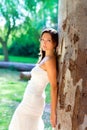 Bride woman happy posing in outdoor tree