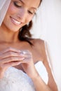 Bride woman, ring and smile at wedding with thinking, pride and commitment at event, celebration and party. Girl