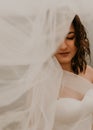 bride woman with short haircut in white wedding corset dress strapless and with a long chiffon veil on head Royalty Free Stock Photo