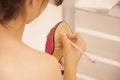 Bride writing names of friends under shoe