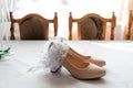 Bride& x27;s accessories. Women& x27;s shoes leather, garter, bridal bouquet, candles, pendant Royalty Free Stock Photo