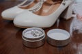 Bride& x27;s accessories. Women& x27;s shoes leather, garter, bridal bouquet, candles, pendant Royalty Free Stock Photo