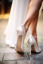 bride& x27;s feet in white shoes. Selective focus.