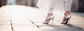 bride& x27;s feet in white shoes. Selective focus.