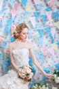 Bride.Young fashion model with make up, ,curly hair, flowers in hair. Bride fashion. Jewelry and Beauty. Woman in white dress Royalty Free Stock Photo