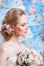 Bride.Young fashion model with make up, ,curly hair, flowers in hair. Bride fashion. Jewelry and Beauty. Woman in white dress Royalty Free Stock Photo