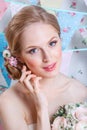 Bride.Young fashion model with make up, ,curly hair, flowers in hair. Bride fashion. Jewelry and Beauty. Woman in white dress Royalty Free Stock Photo