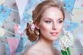 Bride.Young fashion model with perfect skin and make up, flowers in hair. Beautiful woman with makeup and hairstyle in bedroom. Royalty Free Stock Photo