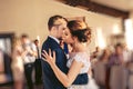 The bridegroom embraces the bride during the wedding dance