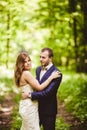 Bridegroom and bride in the spring forest Royalty Free Stock Photo