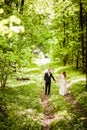Bridegroom and bride in the spring forest Royalty Free Stock Photo