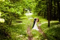 Bridegroom and bride in the spring forest Royalty Free Stock Photo