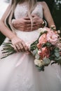 The bridegroom embraces the bride`s waist, Royalty Free Stock Photo