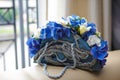 Brides bouquet of blue hydrangeas, lilies and roses in the form of handbags Royalty Free Stock Photo