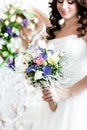 The brides bouquet.A happy bride looking at her bouquet Royalty Free Stock Photo