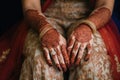 the brides hands with henna tattoos