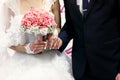 The brides hold hands near wedding banner Royalty Free Stock Photo