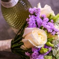 Brides Wedding Bouquet And A Bottle Of Fizzy Prosecco Wine