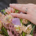 Brides wedding ring with bouquet