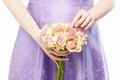 Bridesmaid holding bouquet of pink roses Royalty Free Stock Photo