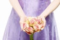 Bridesmaid holding bouquet of pink roses Royalty Free Stock Photo