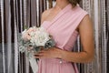 A bridesmaid holding bridal bouquet Royalty Free Stock Photo