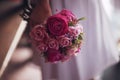 Bridesmaid holding a pink bouquet Royalty Free Stock Photo