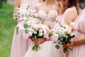 Bridesmaid`s bouquets, wedding bouquets closeup. Stylish summer wedding. Contemporary fashion wedding trends. Royalty Free Stock Photo