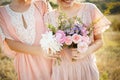 Bridesmaids in pink dresses with bouquets Royalty Free Stock Photo