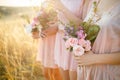 Bridesmaids in pink dresses with bouquets Royalty Free Stock Photo