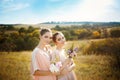 Bridesmaids in pink dresses with bouquets Royalty Free Stock Photo