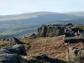 Bridestones moor in west yorkshire with gritstone outcrops surrounded by hills on a sunny day