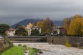 Bridge across of Bisenzio River and river shore. Prato. Tuscany. Italy.