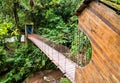 Bridge across Rio Tigre waterfall in jungle of Oxapampa in Peru