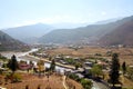 Bridge across the river with traditional Bhutanese style houses