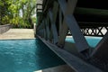 Bridge across water channel. Metal frame structure over pure calm river. Modern urban city landscape with perspective view. Quay Royalty Free Stock Photo