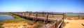 Bridge along the peaceful and tranquil marsh of Bolsa Chica wetlands Royalty Free Stock Photo