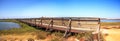 Bridge along the peaceful and tranquil marsh of Bolsa Chica wetlands Royalty Free Stock Photo