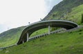 A bridge, a bend, and a gallery on Gotthard motorway pass street, Switzerland Royalty Free Stock Photo