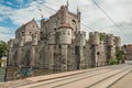 Bridge and bike in front of Gravensteen Castle on cloudy day in Ghent.