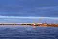 Bridge and boat with barge on the Nadym river in Siberia