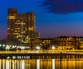 Bridge and buildings at night, at the Inner Harbor of Baltimore, Maryland. Royalty Free Stock Photo