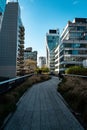 Bridge in a bustling urban cityscape with high-rise buildings in New York.