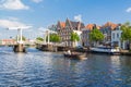 Bridge and canal boat on Spaarne river, Haarlem, Netherlands Royalty Free Stock Photo