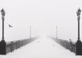 Bridge city landscape in foggy snowy winter day Royalty Free Stock Photo