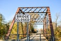 Bridge closed sign on an old bridge