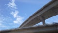 Bridge and clouds with blue skies in California from the train 2 Royalty Free Stock Photo