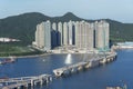 Bridge in construction and high rise residential building in Hong Kong city Royalty Free Stock Photo