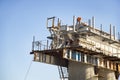 Bridge construction manual labour, the place of workers on tall poles