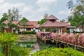 Bridge with flowers across the bay in a tropical garden